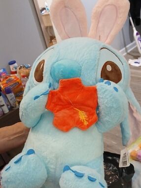 Blue Bunny Plush Holding Orange Flower Plush